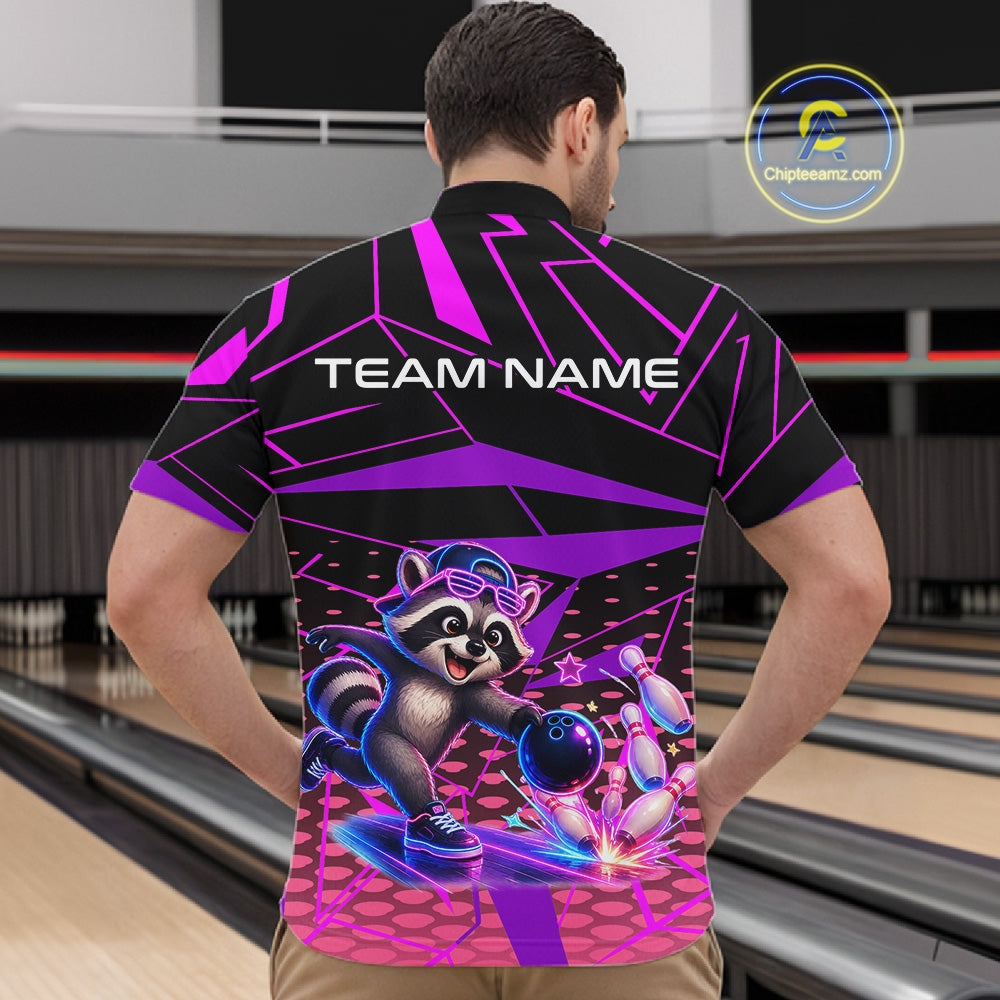 Person wearing a bowling shirt with a raccoon graphic and 'TEAM NAME' text in a bowling alley.