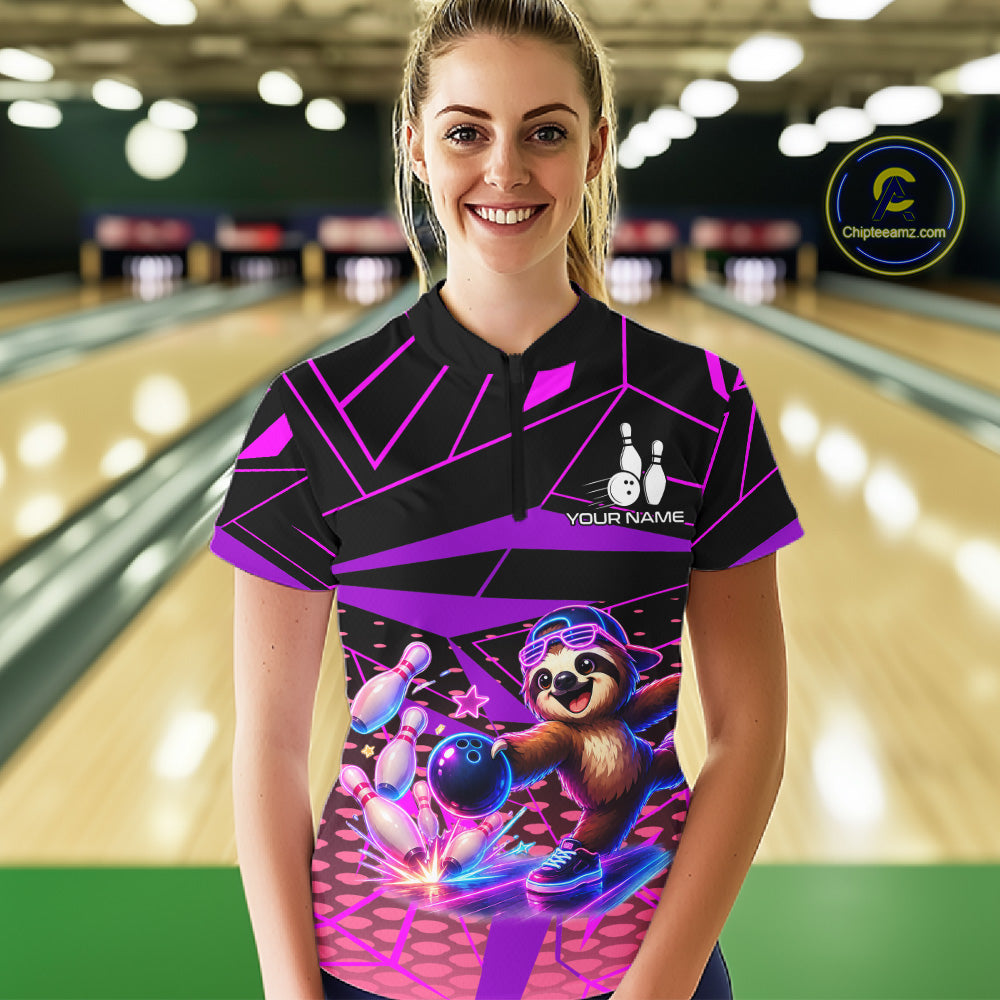 Person wearing a bowling shirt with a sloth graphic in a bowling alley