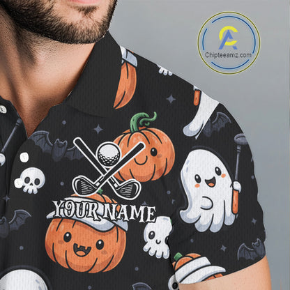 A close-up of a man wearing a black short-sleeve polo shirt with a Halloween golf print. The shirt features cartoon pumpkins, ghosts, bats, skulls, golf clubs, and a customizable text placeholder reading 'YOUR NAME'.