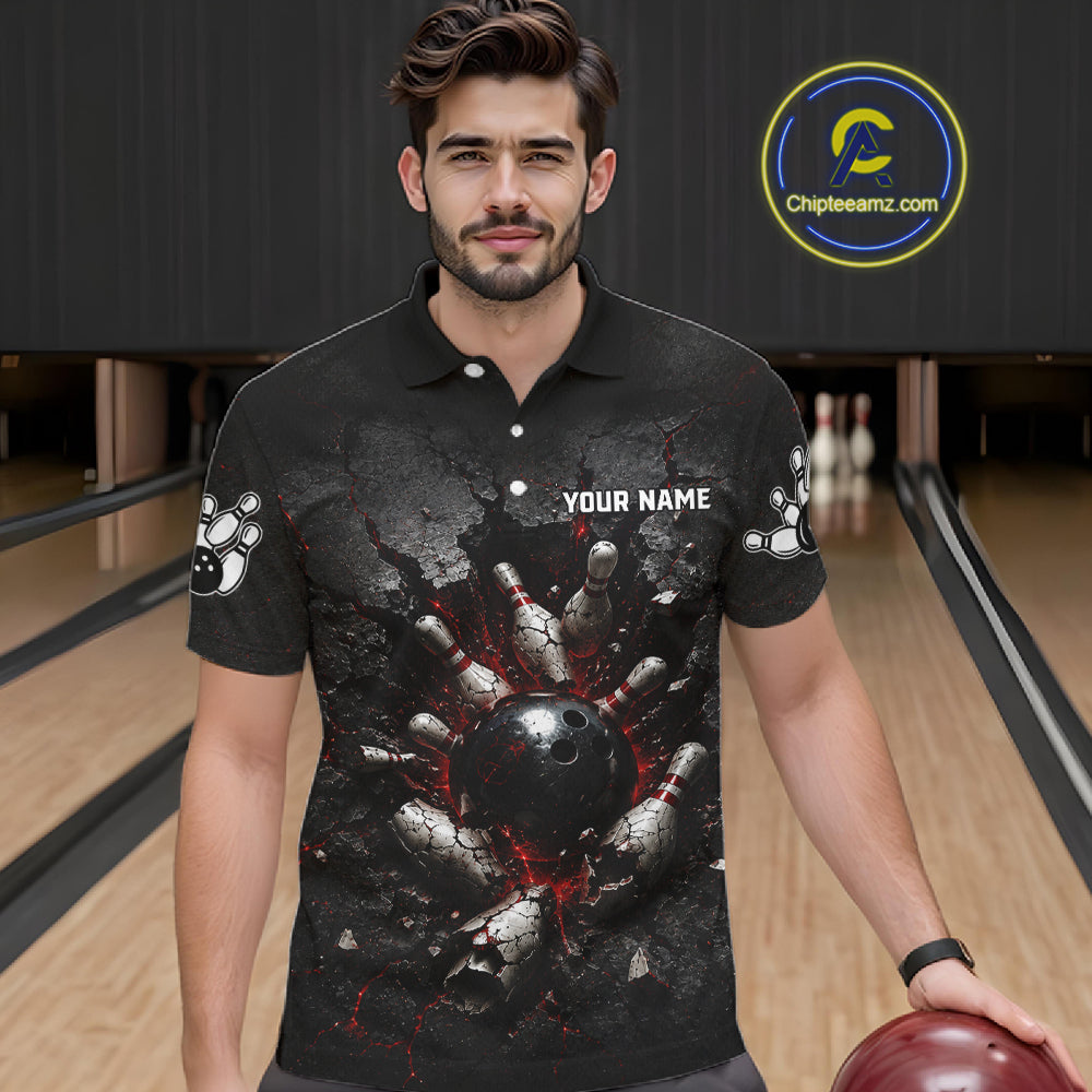Man wearing a black bowling-themed shirt with a graphic design in a bowling alley.
