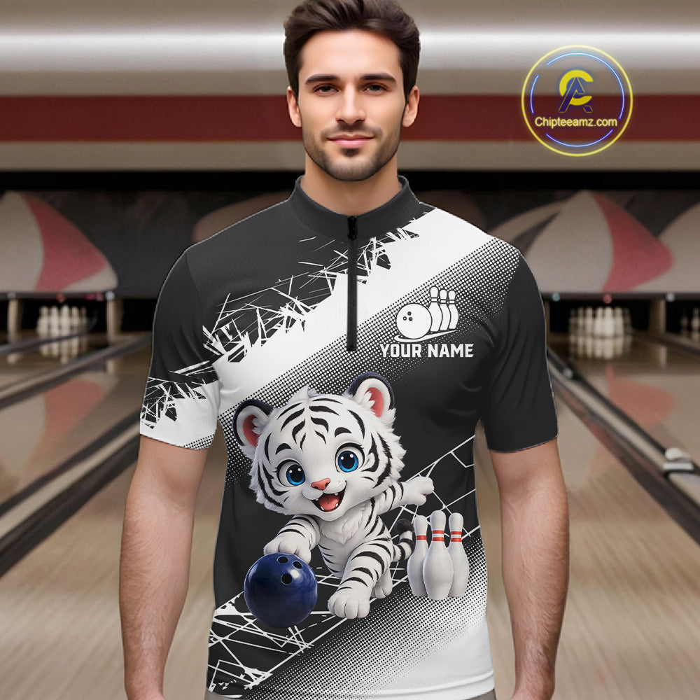 Man wearing a bowling-themed shirt with a tiger design in a bowling alley.