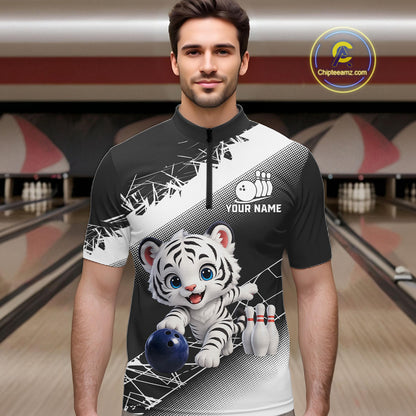 Man wearing a bowling-themed shirt with a tiger design in a bowling alley.