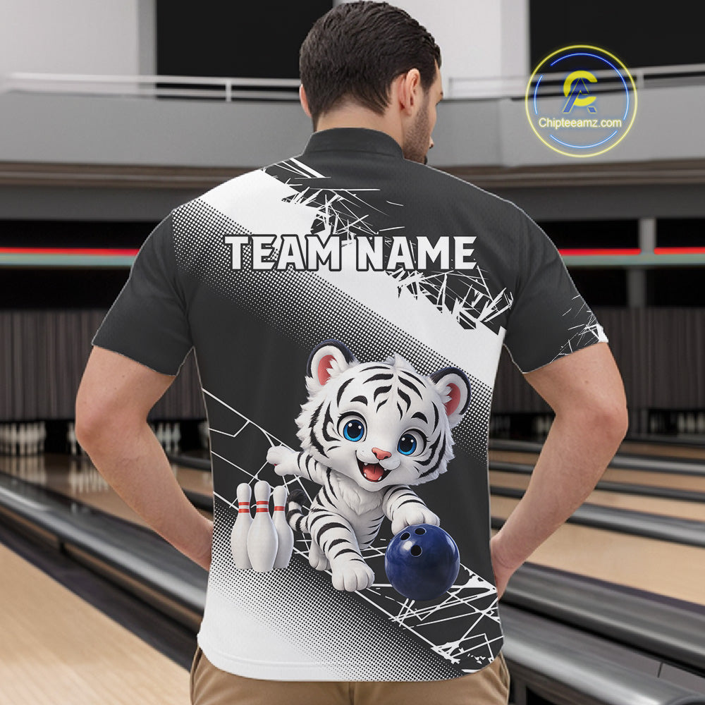 Person wearing a bowling shirt with a tiger design and 'TEAM NAME' text in a bowling alley.