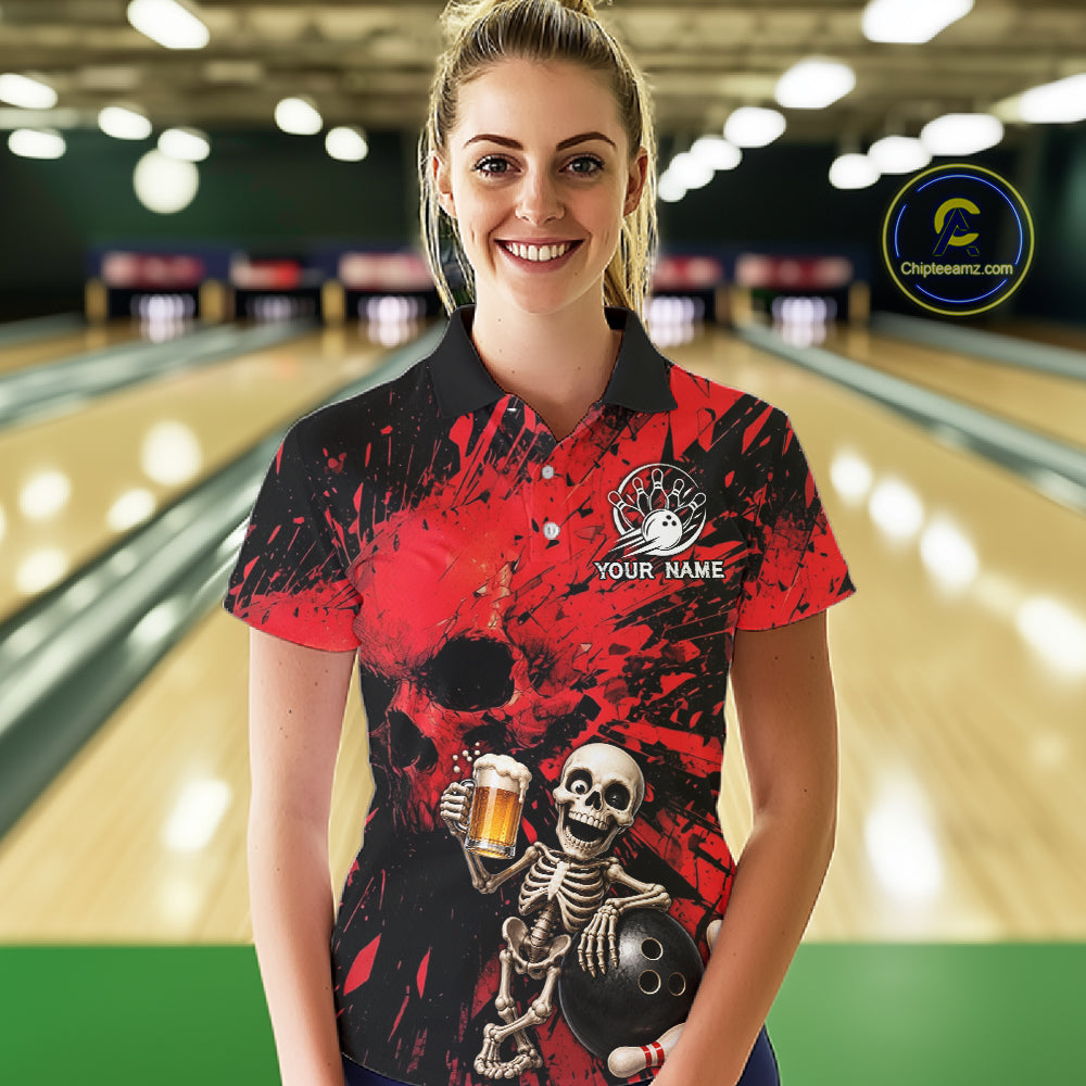 Person wearing a red and black bowling shirt with a skeleton design in a bowling alley.