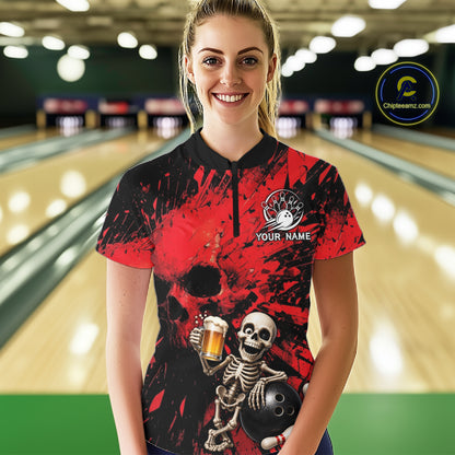 Person wearing a red and black bowling shirt with a skeleton design in a bowling alley.