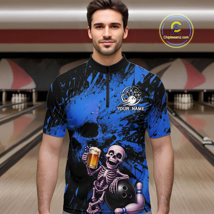 Man wearing a blue and black bowling shirt with a skeleton design in a bowling alley.