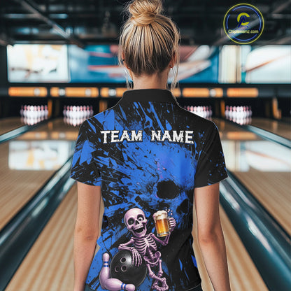 Person wearing a bowling shirt with a skeleton design in a bowling alley.