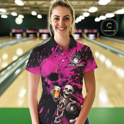 Person wearing a pink and black bowling shirt with a skeleton design in a bowling alley.