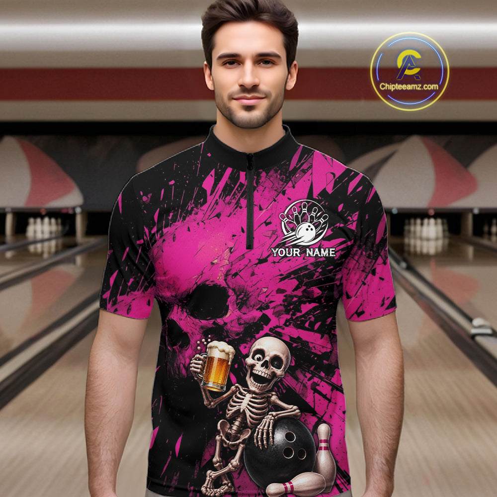 Man wearing a pink and black bowling shirt with a skeleton design in a bowling alley.