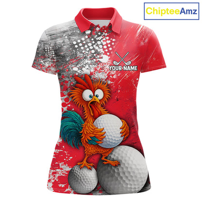 A women's short-sleeve polo shirt with a red collar and a vibrant red, white, and gray paint-splatter graphic. The front features a cartoon rooster holding two white golf balls, with 'YOUR NAME' and crossed golf clubs printed on the chest.