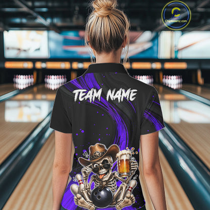 Person wearing a black bowling shirt with a skeleton design in a bowling alley.