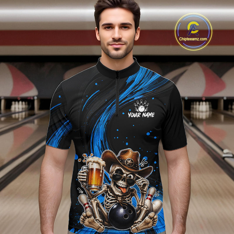 Man wearing a black and blue bowling shirt with a skeleton design in a bowling alley.