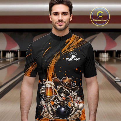 Man wearing a black and yellow bowling shirt with a skeleton design in a bowling alley.