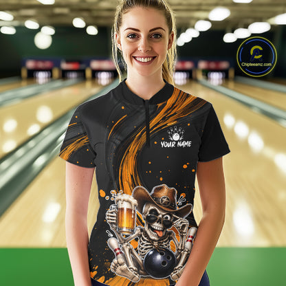 Person wearing a black bowling shirt with a skeleton and beer design in a bowling alley.