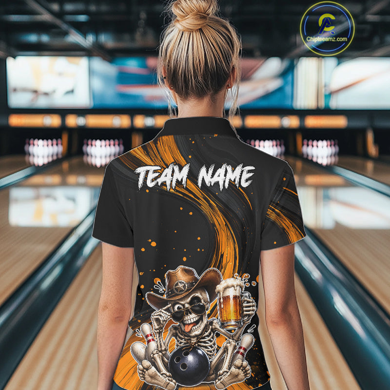 Person wearing a bowling shirt with a skeleton holding a beer and bowling ball design in a bowling alley.