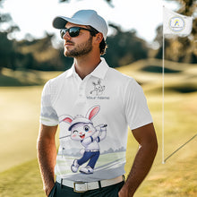 Load image into Gallery viewer, Man wearing a white polo shirt with a cartoon character on a golf course