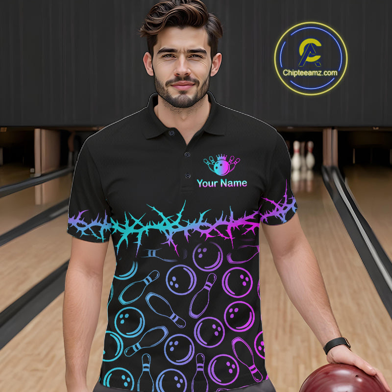 A man wearing a black short-sleeve polo shirt with a colorful bowling-themed print, standing in a bowling alley. The shirt features a neon cyan and purple thorn pattern across the chest and waist, with bowling pins and balls printed below.