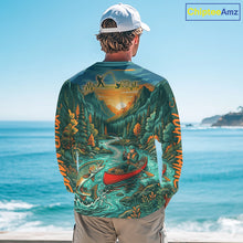 Load image into Gallery viewer, Person wearing a long-sleeve shirt with a nature-themed design by the ocean.