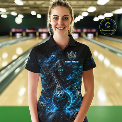 Person wearing a custom bowling shirt with a blue and black design in a bowling alley.
