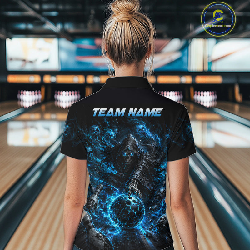 Person wearing a black t-shirt with a blue graphic design and 'TEAM NAME' text in a bowling alley.