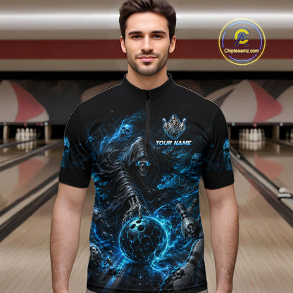 Man wearing a black and blue bowling shirt with a design and text in a bowling alley.