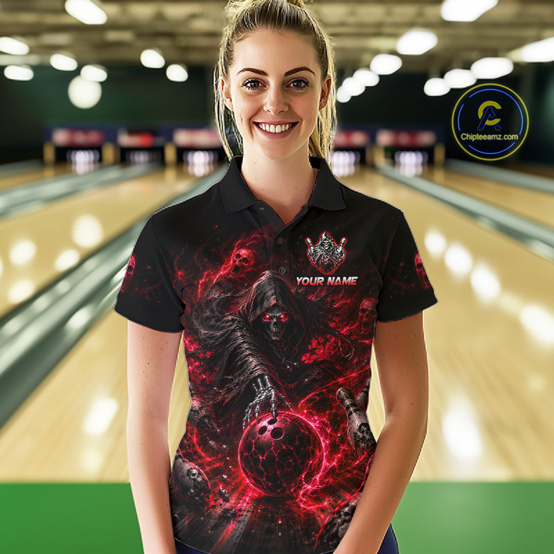 Person wearing a black t-shirt with a red and black design and 'TEAM NAME' text in a bowling alley.