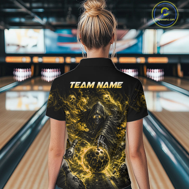 Person wearing a black t-shirt with a graphic design and 'TEAM NAME' text in a bowling alley.