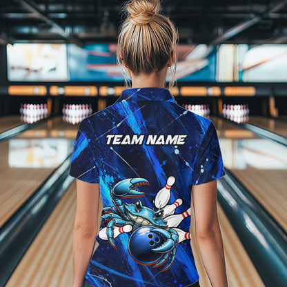 Person wearing a blue bowling shirt with a design and 'TEAM NAME' text in a bowling alley.
