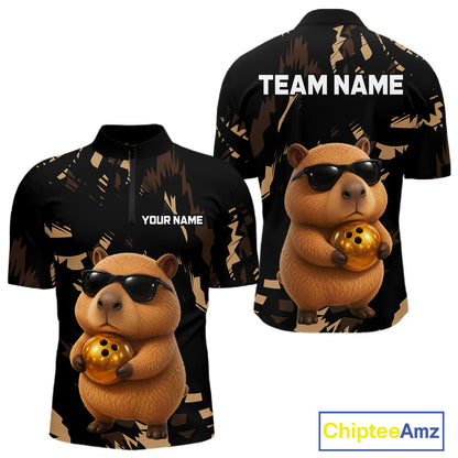 Two black shirts with a capybara holding a gold ball design, one with 'Your Name' and 'Team Name' text, the other with 'Chiptee Amz' branding.