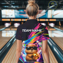 Load image into Gallery viewer, Person wearing a colorful bowling shirt with a bear design in a bowling alley.