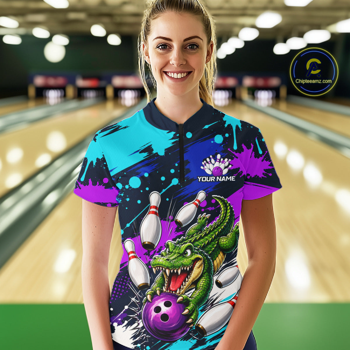 Person wearing a colorful bowling shirt with a dragon design in a bowling alley.