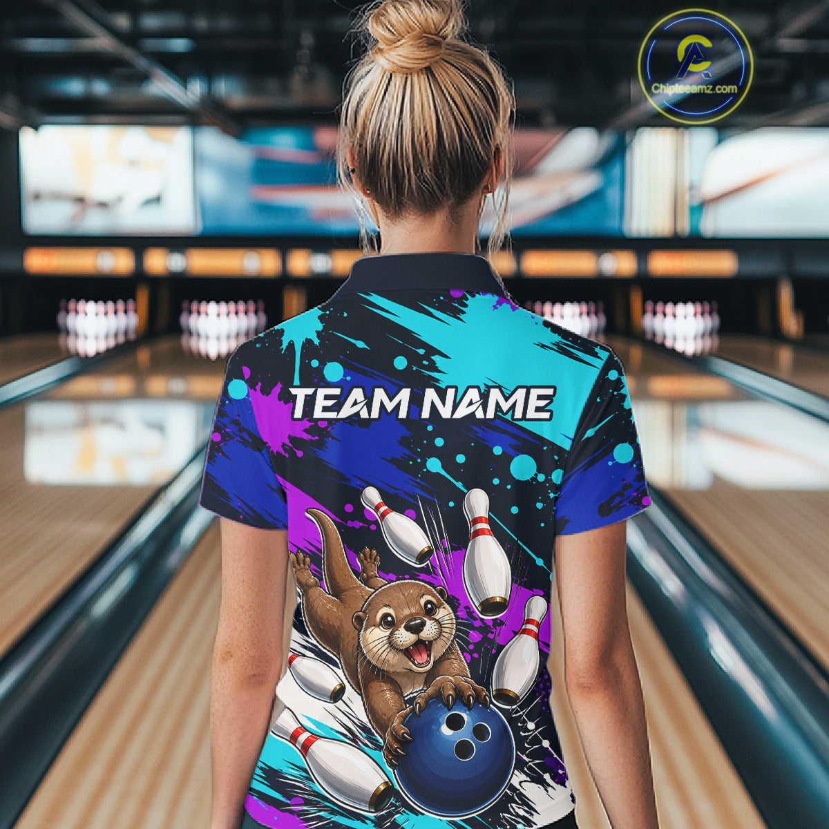Person wearing a colorful bowling-themed shirt with 'Team Name' text in a bowling alley.