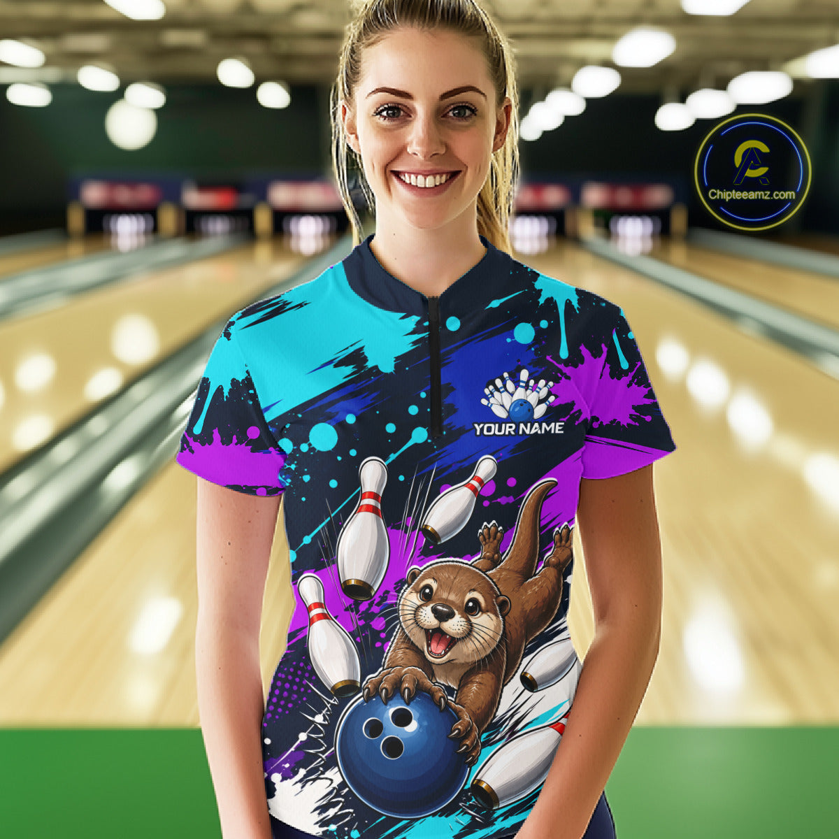Person wearing a colorful bowling jersey with an otter and bowling ball design in a bowling alley.
