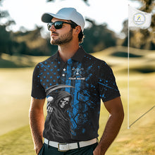 Load image into Gallery viewer, Golfer wearing custom black and blue American flag skull reaper golf polo shirt on the course - front view