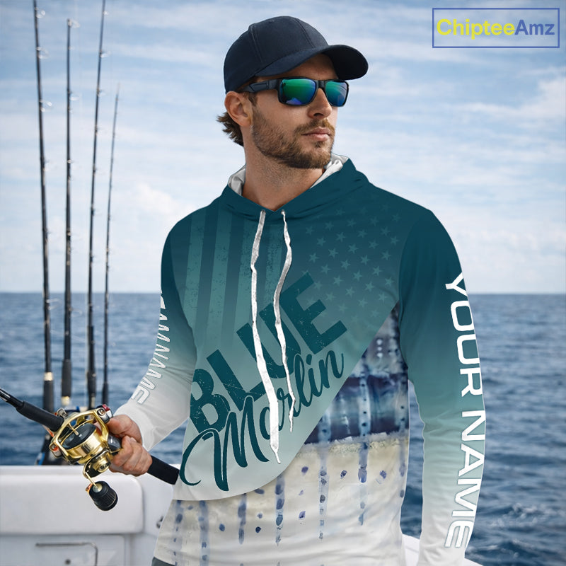 Angler wearing patriotic American Flag Marlin long sleeve hooded fishing shirt on boat