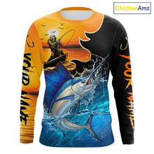 Load image into Gallery viewer, Long sleeve fishing shirt with a fisher reaper and sailfish design on an orange and black background