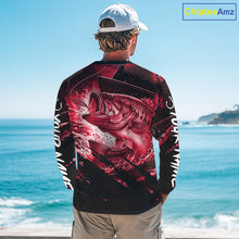 Load image into Gallery viewer, Person wearing a red and black bass fishing shirt with a fish design, standing by the ocean.