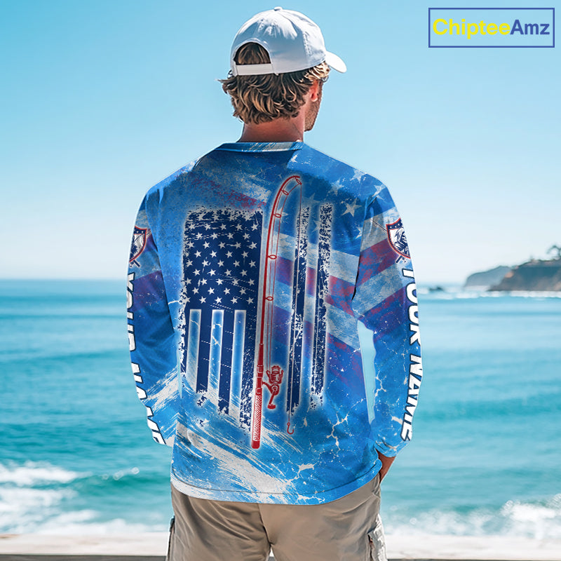 Man on a boat wearing a blue American flag northern pike fishing shirt with custom name on the sleeves