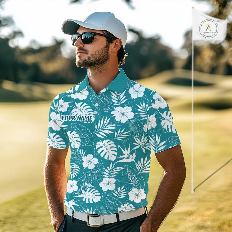 Man wearing a tropical patterned shirt on a golf course with a flag in the background.