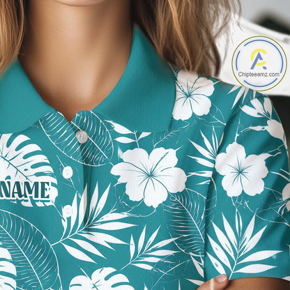 Teal golf polo shirt with white floral and tropical leaf pattern