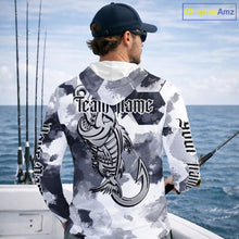 Load image into Gallery viewer, Man wearing personalized fish skeleton long sleeve hooded fishing shirt with custom team name on the back