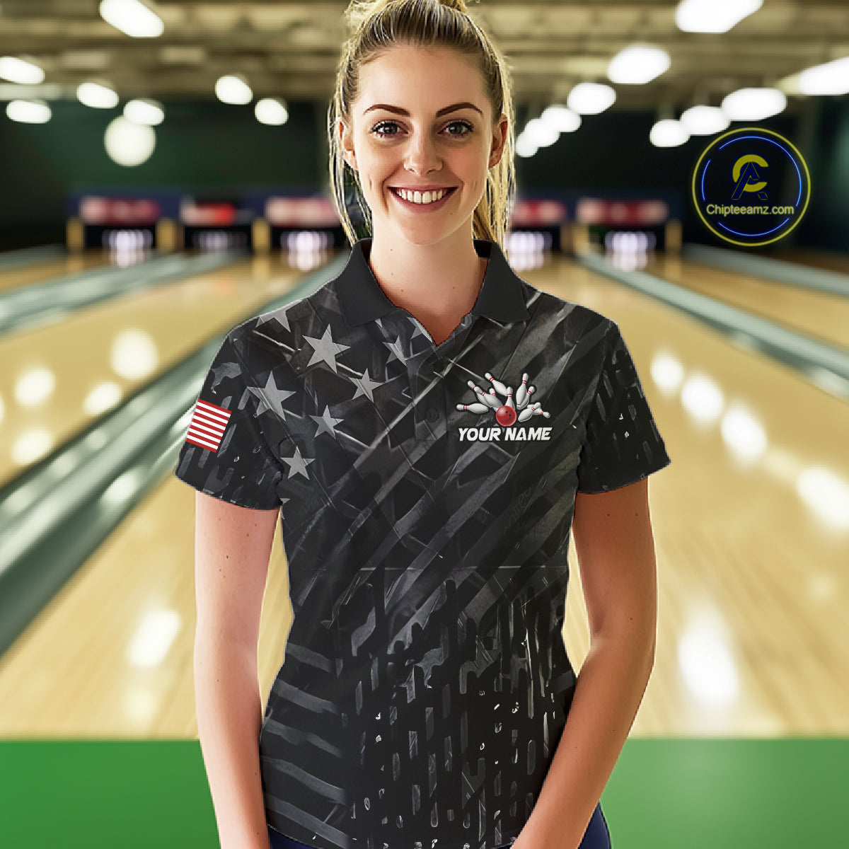 Woman wearing a black American flag wings bowling polo shirt at a bowling alley front view.