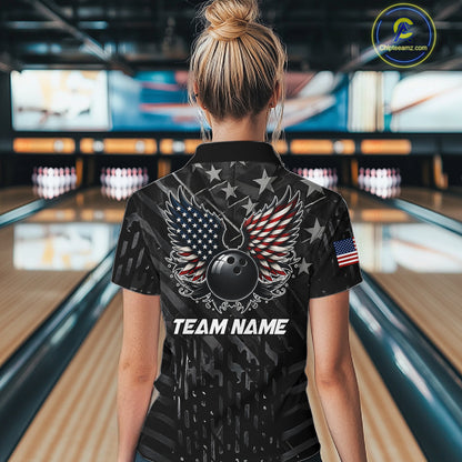 Back view of woman wearing a black American flag wings bowling polo shirt inside a bowling alley.