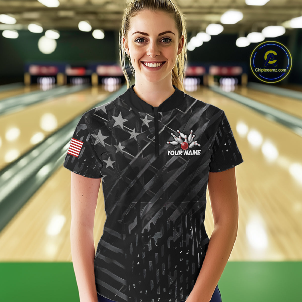 Woman wearing a black American flag wings bowling quarter zip jersey during tournament play front view.