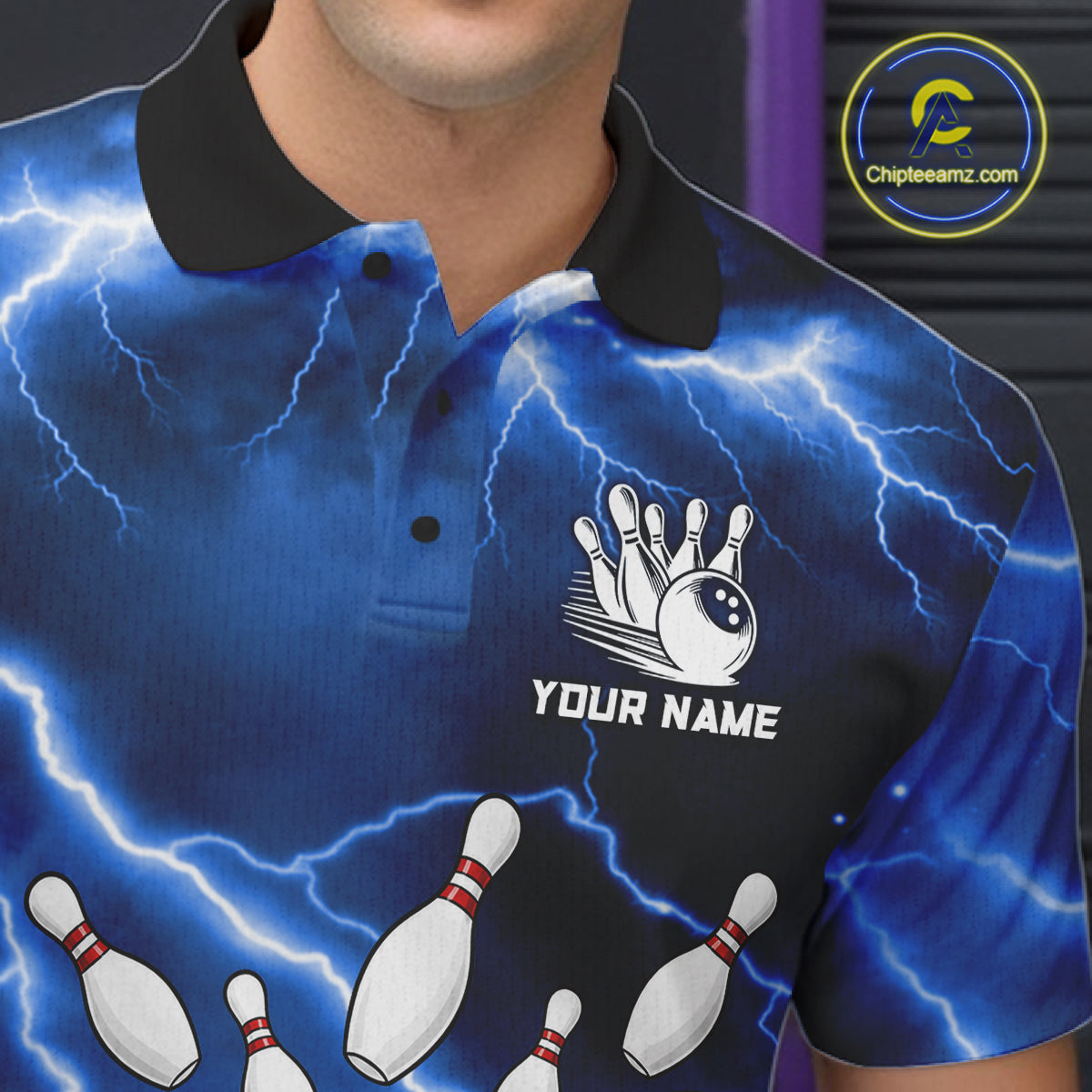 Close-up of a blue thunder lightning tornado bowling polo shirt collar, buttons, and storm artwork.