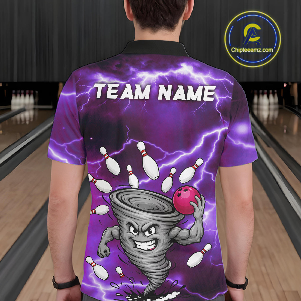 Back view of man wearing a purple thunder lightning tornado bowling polo shirt inside a bowling alley.