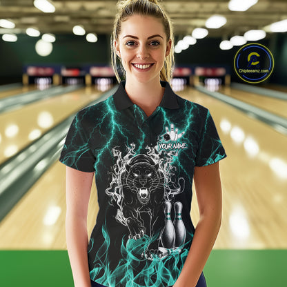 Woman wearing a turquoise flaming panther bowling polo shirt at a bowling alley front view.