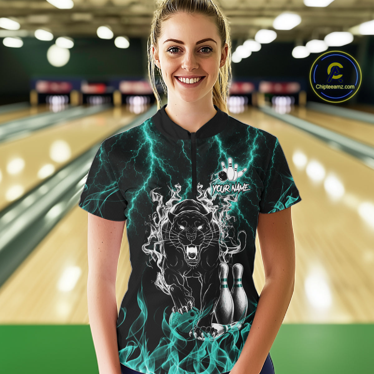 Woman wearing a turquoise flaming panther bowling quarter zip jersey during league competition front view.