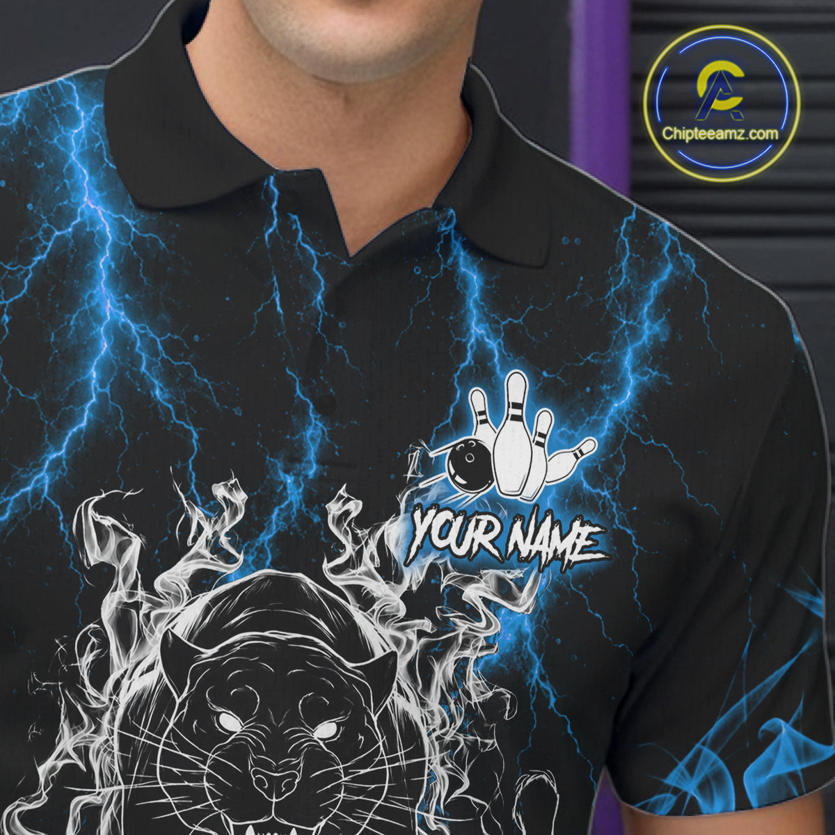 Close-up of a blue flaming panther bowling polo shirt collar, buttons, and panther artwork details.