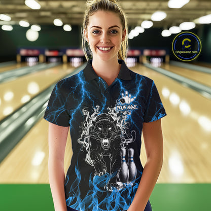Woman wearing a blue flaming panther bowling polo shirt at a bowling alley front view.